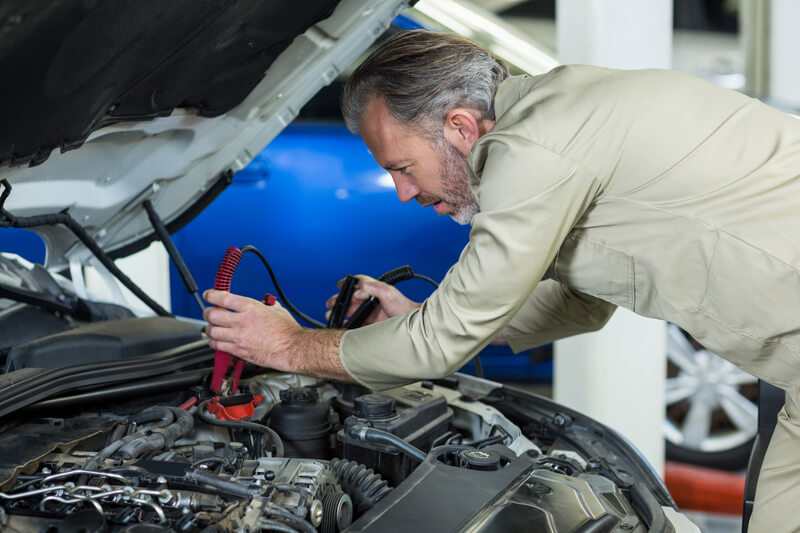 a man connect the battery 