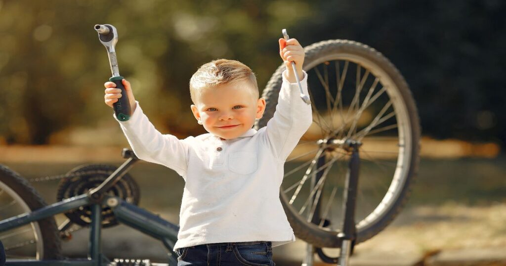 Little Boy Repair His Bike