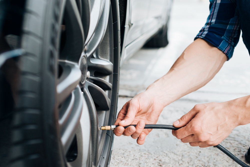 a man use tire pressure gauge