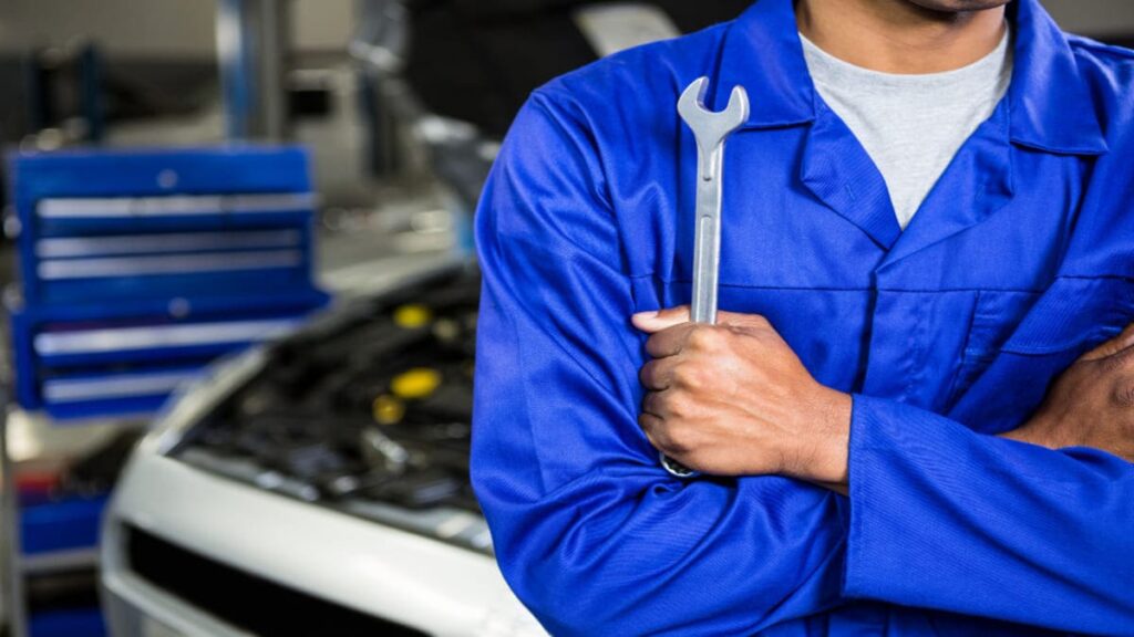 a mechanic stand near the car